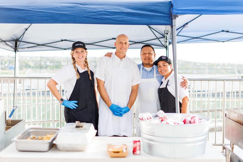 Hires Big H catering setup with burgers and fries