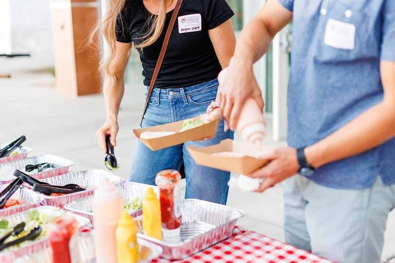 Building burgers at catering event